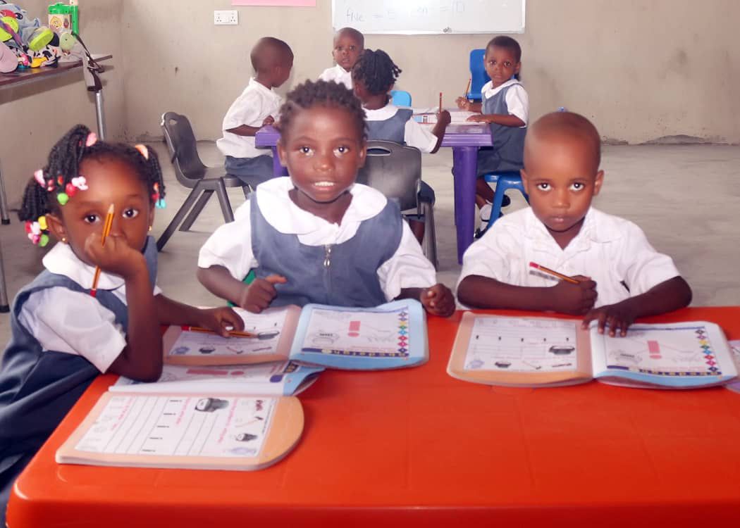 Students at Anchor Christian Academy working at their desks
